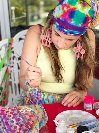 Sara Joy's collaboration with FAENA HOTEL. She is hand painting her merchandise for a pop-up shop.