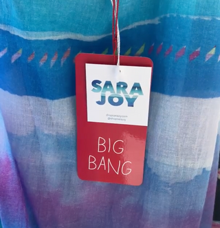 Sara Joy x Big Bang collaboration tag.