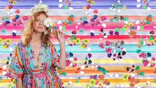 Model wearing Sara Joy Painted Floral Caftan with the Painted Floral design in the background.
